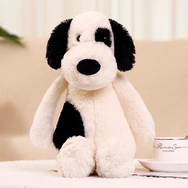 peluche chien blanc avec œil noir