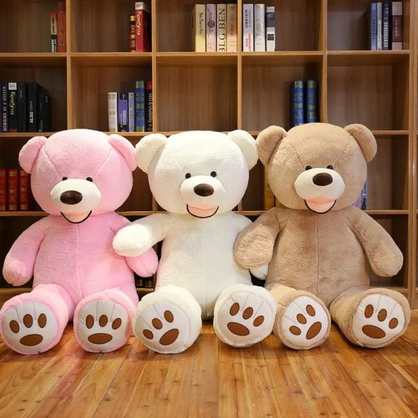ours en peluche géant coloré et souriant