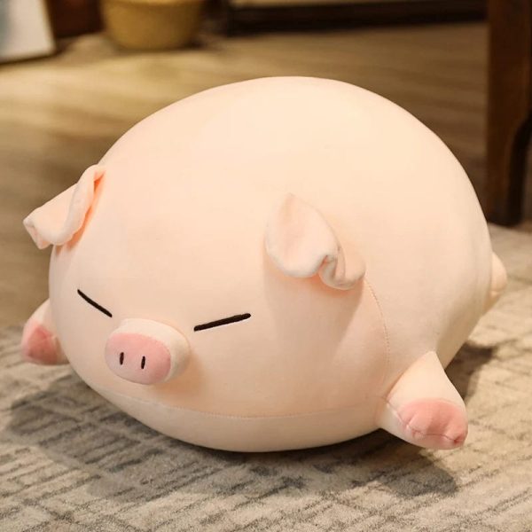 Peluche cochon allongé yeux fermés