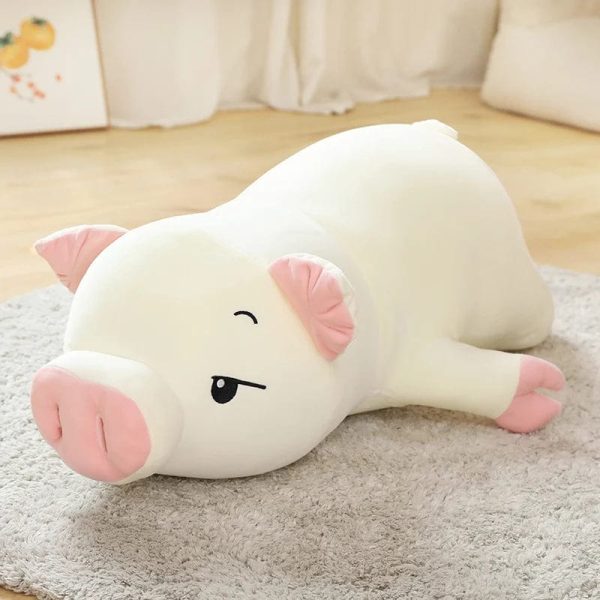 Peluche cochon allongé endormi