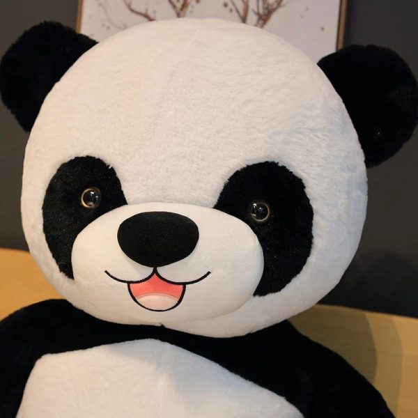 Peluche panda géant avec fleur